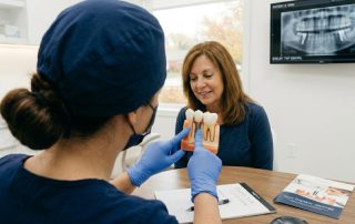 Patient smiling with a dental implant crown restoration at HPS Advanced Dental Care in Shelby Township Michigan