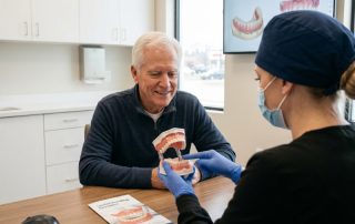 Confident patient smiling with full dentures at HPS Advanced Dental Care in Shelby Township Michigan